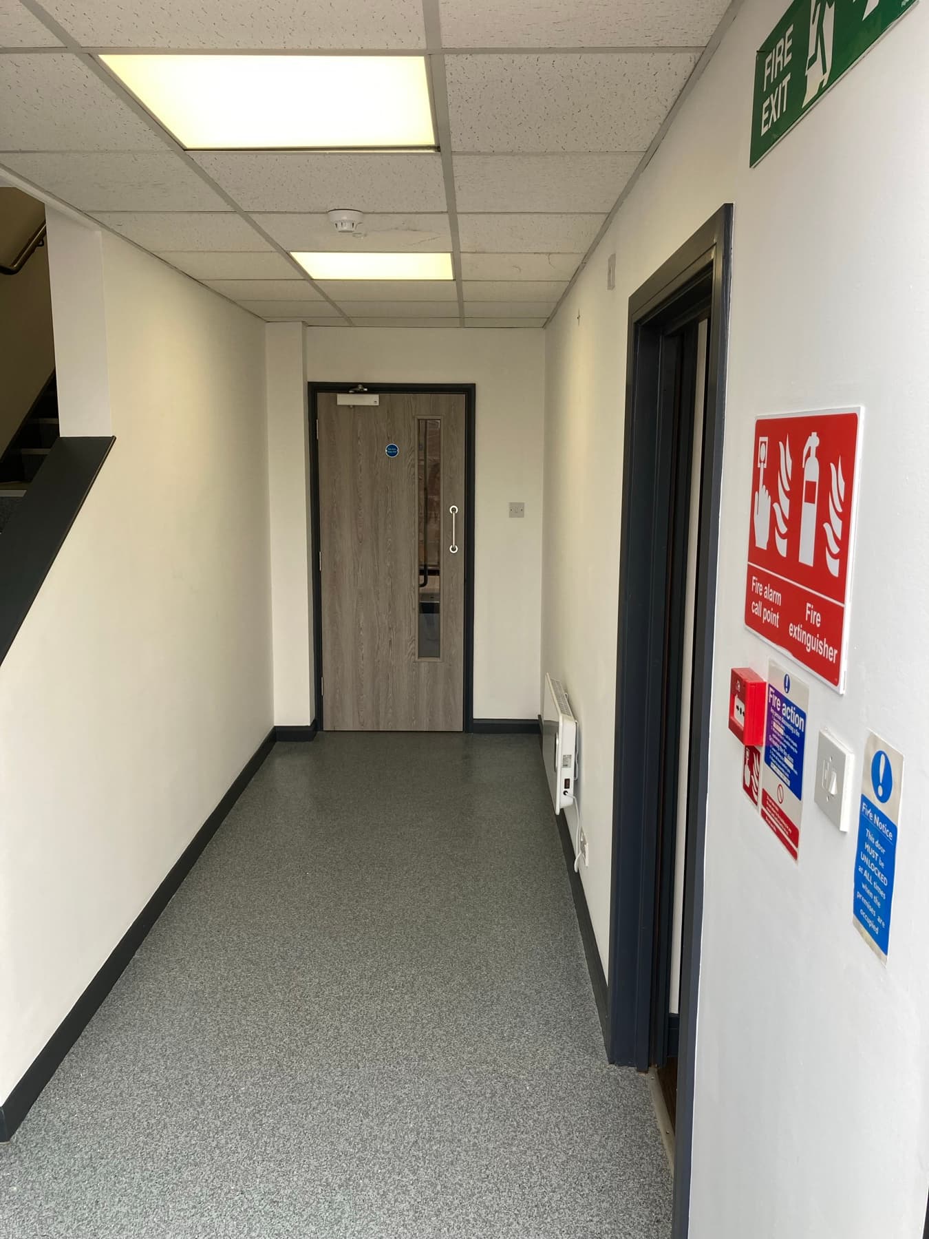 Precision skirting and floor edge detail against brilliant white wall