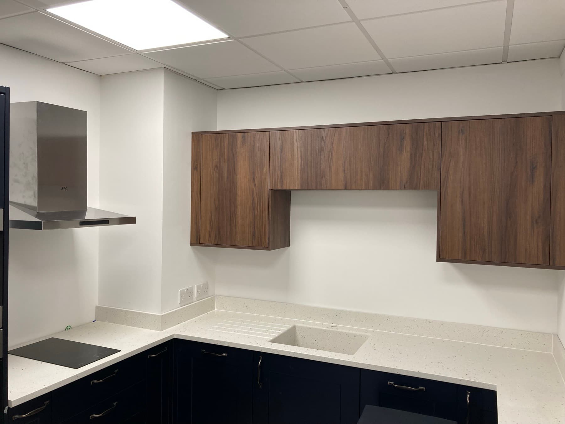 Bespoke media wall with shelving and high-sheen woodwork