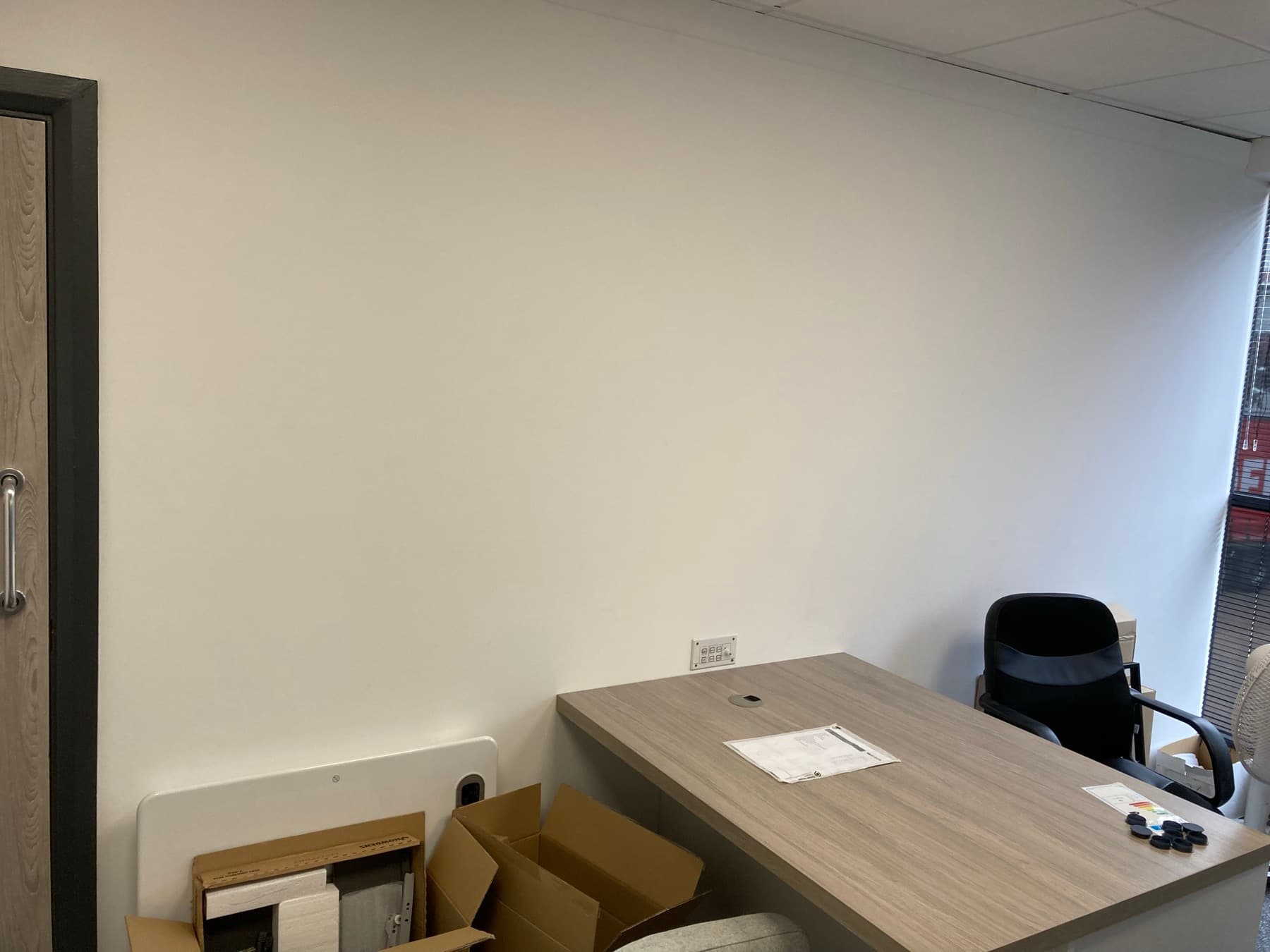 Grey slatwall corridor feature with even, professional paint finish