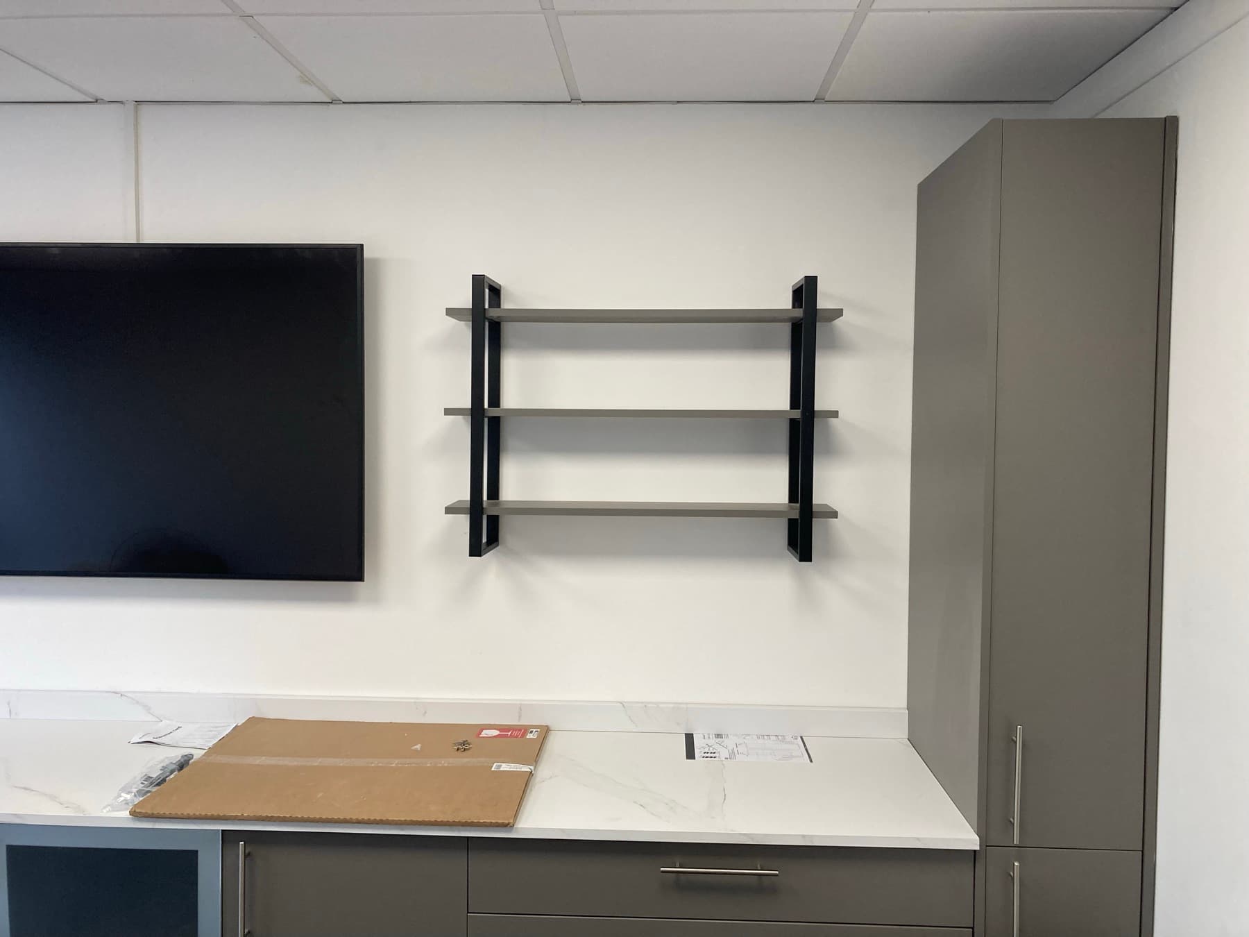Meeting room with glazed charcoal door and pristine painted walls