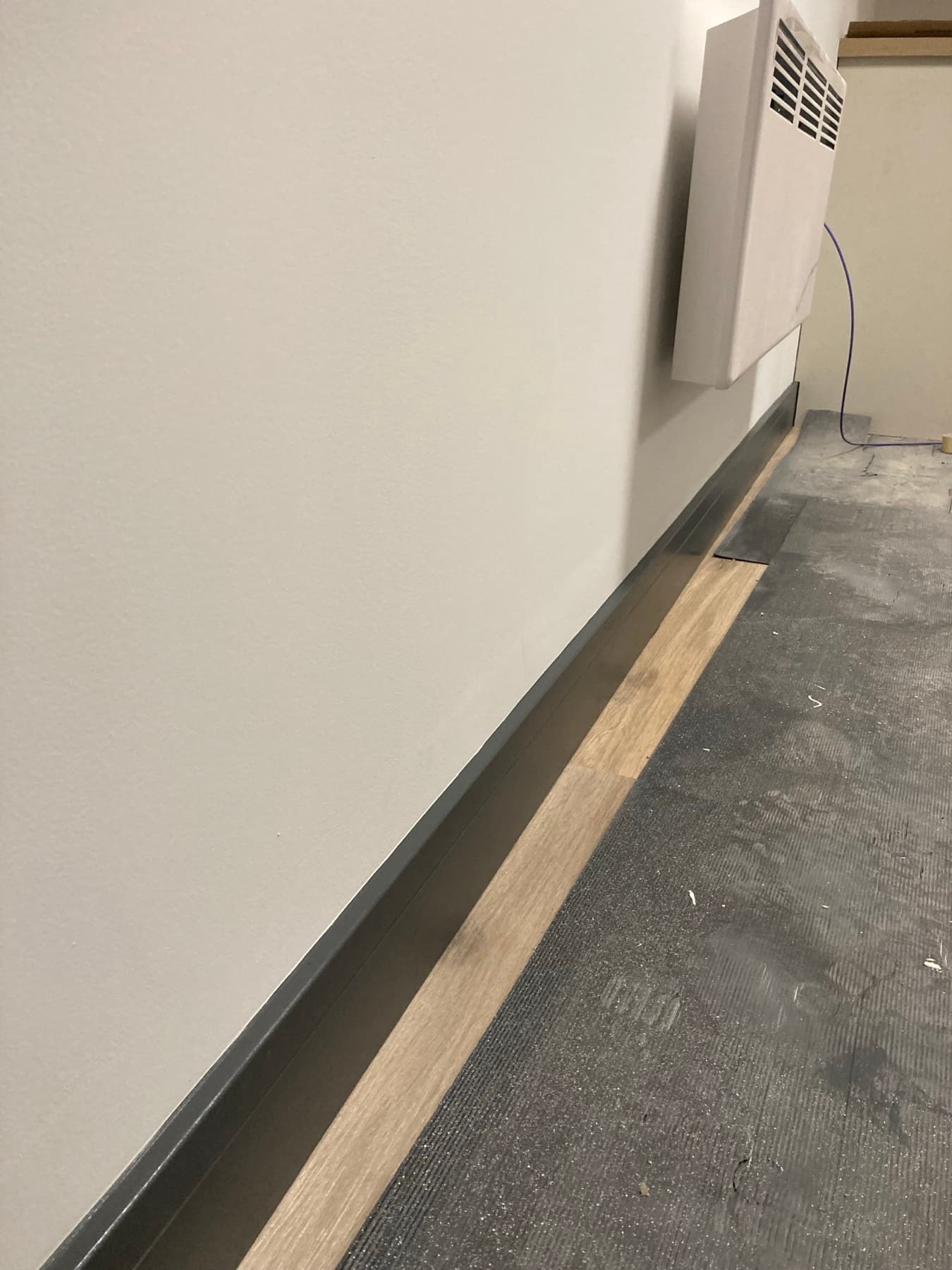 High-traffic corridor coated in scrubbable trade emulsion