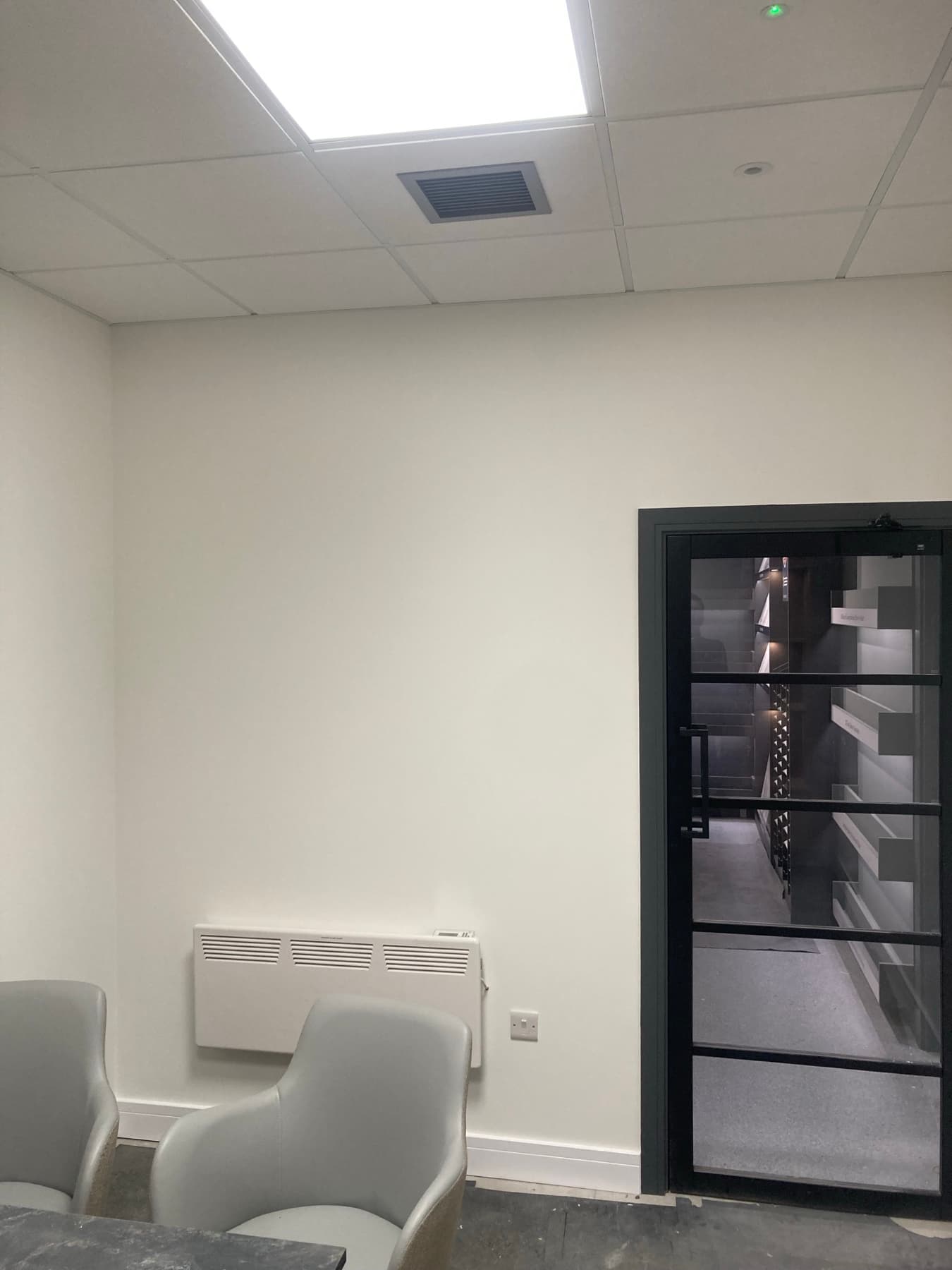 Completed Howdens branch interior with high-contrast scheme